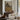 The Twin Pines Wall Art in a Black Floating Frame above a walnut console in a sitting room