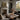 The Valley Stream Wall Art in a Black Floating Frame on a fireplace mantel