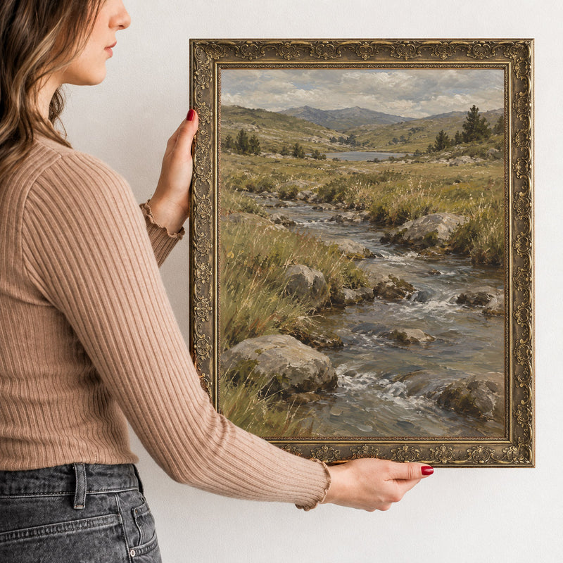 The Valley Stream Wall Art in a Gold Ornate Frame, held to show its size