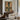The Water Door Wall Art in a Gold Ornate Frame above a walnut console in a sitting room