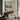 The Winter Peak Wall Art in a Black Floating Frame above a walnut console in a sitting room