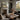 The Winter Peak Wall Art in a Natural Floating Frame on a fireplace mantel