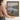 The Wooden Jetty Wall Art in a Gold Ornate Frame, held to show its size