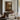 Through the Mill Window Wall Art in a Gold Ornate Frame above a walnut console in a sitting room