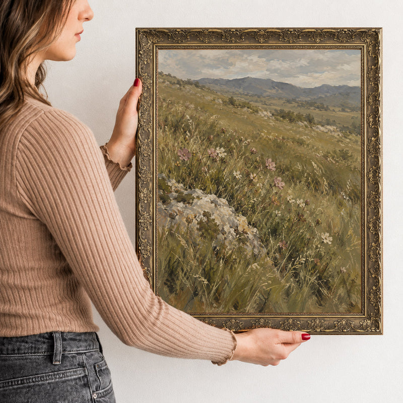 Wildflowers at the Rock Wall Art in a Gold Ornate Frame, held to show its size