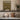 Wildflowers at the Rock Wall Art in a Gold Ornate Frame on a kitchen shelf