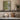 Willows in Reflection Wall Art in a Gold Ornate Frame on a kitchen shelf