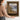 Window on the Loch Wall Art in a Gold Ornate Frame, held to show its size